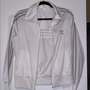 White and silver Adidas track suit